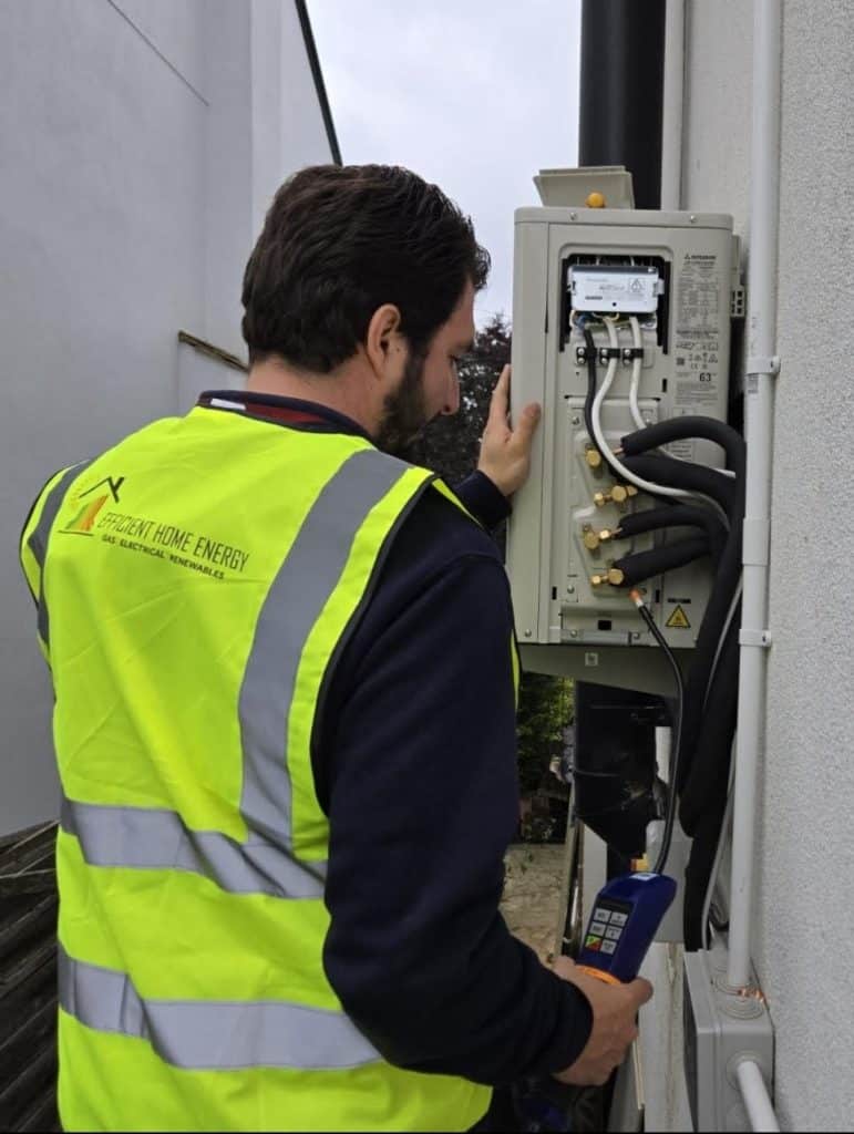 engineer installing an air conditioning unit in Havering